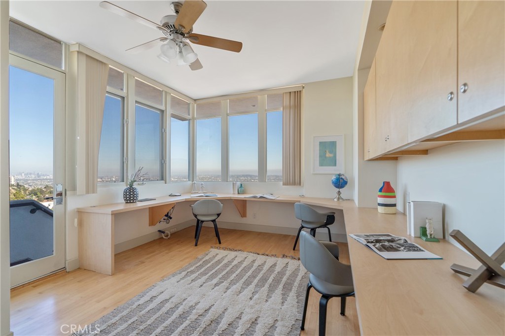 1436 Summitridge Drive Beverly Hills, CA 90210 - Photo 21 of 28 a room with furniture and wooden floor