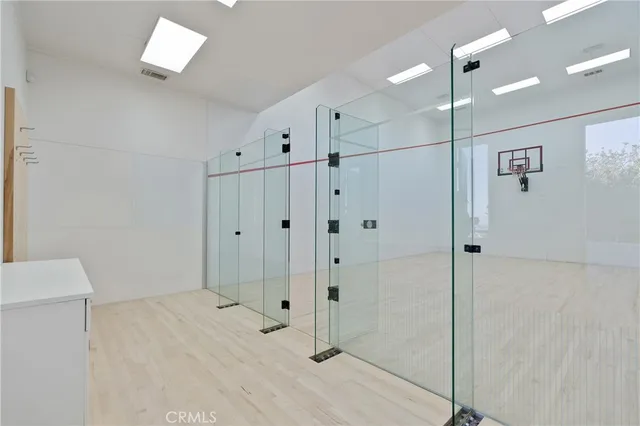 a view of house with garden and tall trees