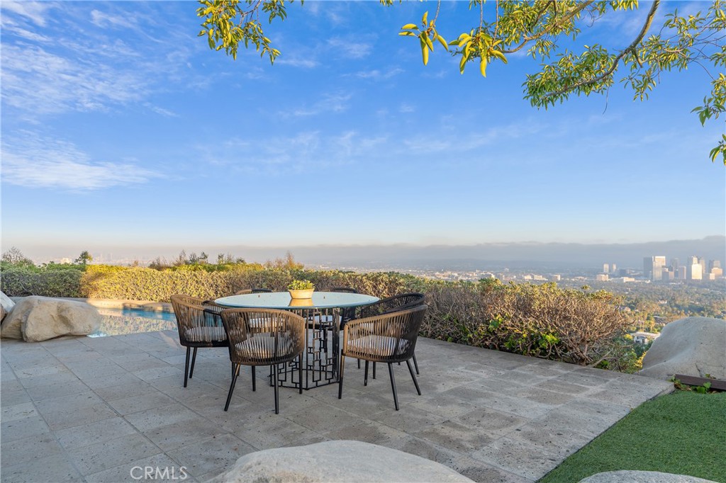 1436 Summitridge Drive Beverly Hills, CA 90210 - Photo 26 of 28 a view of a terrace with furniture and mountain view