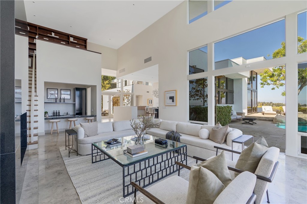 1436 Summitridge Drive Beverly Hills, CA 90210 - Photo 5 of 28 a living room with furniture