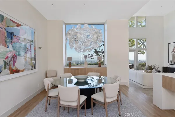 a dining room with furniture and wooden floor