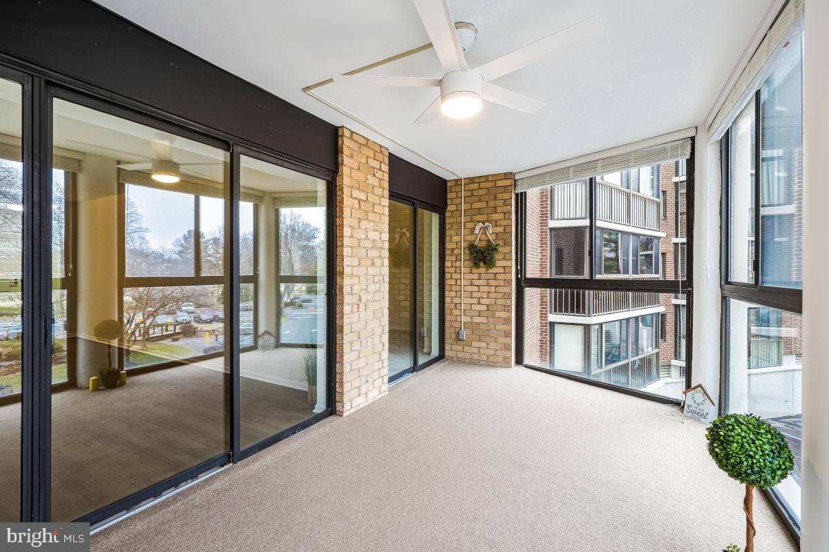 15107 Interlachen Drive, Unit 2215 Silver Spring, MD 20906 - Photo 15 of 31 a view of an empty room with a floor to ceiling window