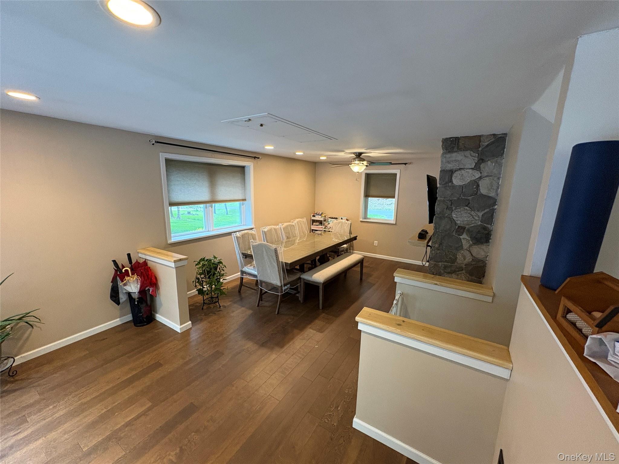 68 Whitford Road Westtown, NY 10998 - Photo 13 of 39 Spacious dining area featuring wood-finish flooring, recessed lighting, and a stone accent wall