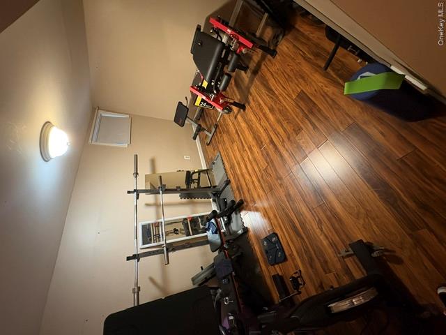 68 Whitford Road Westtown, NY 10998 - Photo 20 of 39 Hardwood-finish flooring throughout, featuring a neutral wall color, white baseboards, and a flush-mount ceiling light fixture