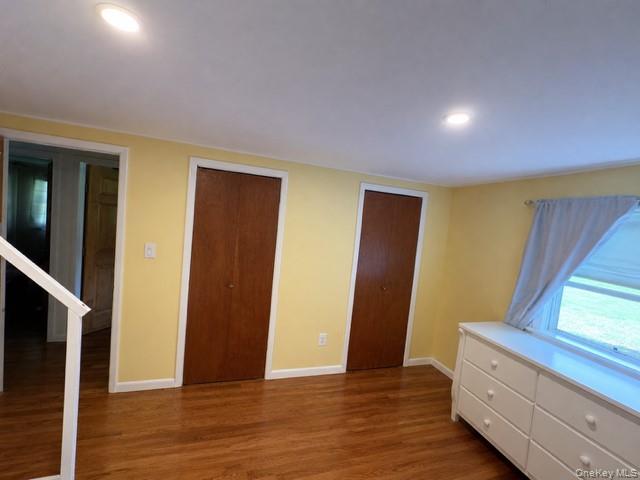 68 Whitford Road Westtown, NY 10998 - Photo 24 of 39 Interior room featuring wood-finish flooring, two recessed ceiling lights, and two bifold doors