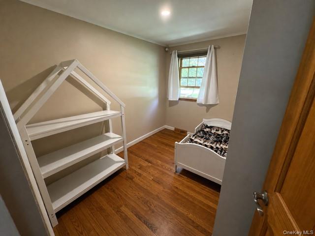 68 Whitford Road Westtown, NY 10998 - Photo 26 of 39 Room featuring wood-finish flooring, neutral wall paint, and a window with trim