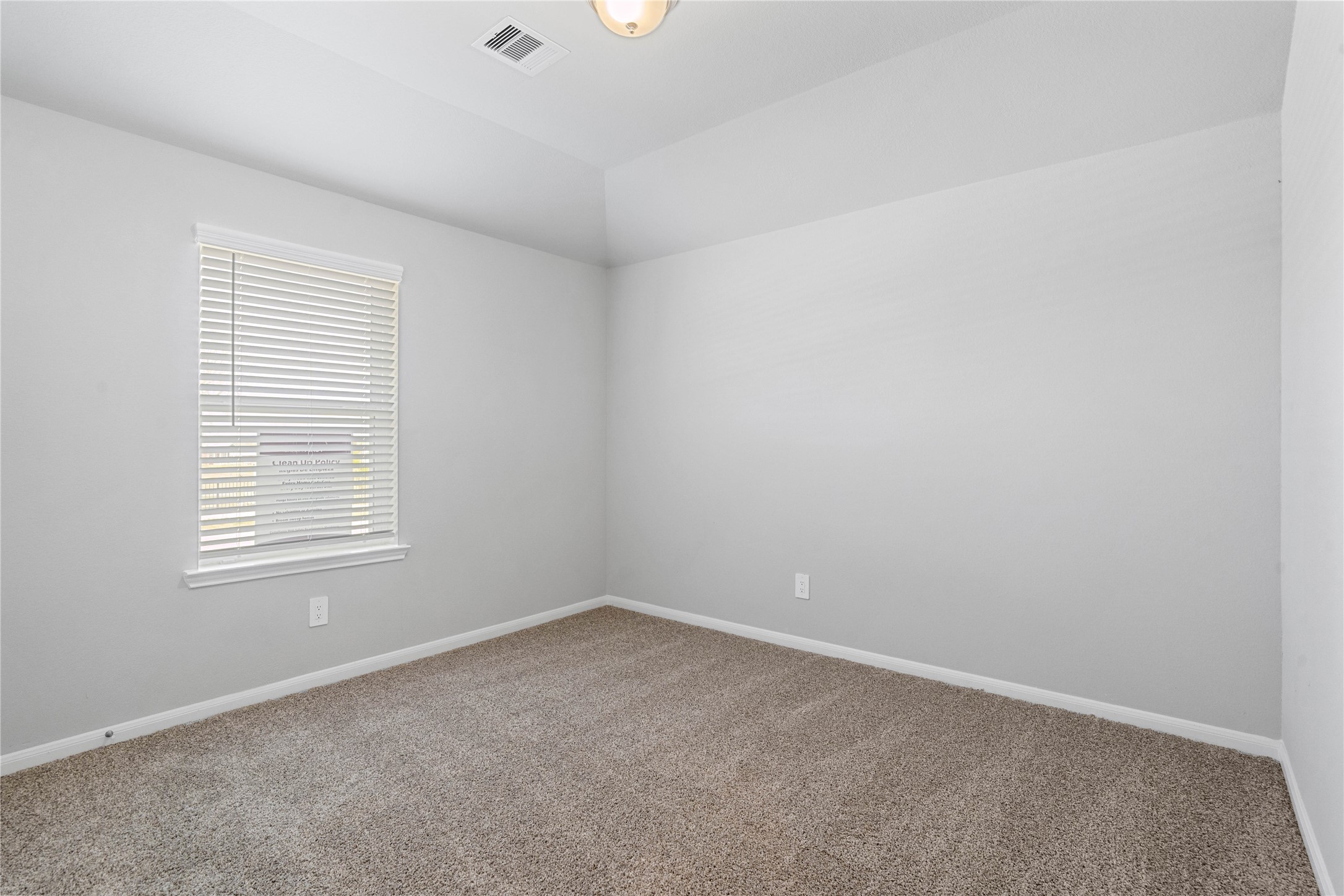 19645 Montgomery Rdg Way Montgomery, TX 77316 - Photo 8 of 41 This cozy secondary bedroom offers plush soft carpeting, neutral walls ready for personalization, a sun-filled window with fitted blinds, sloped ceilings, and a spacious closet for all your storage needs.
