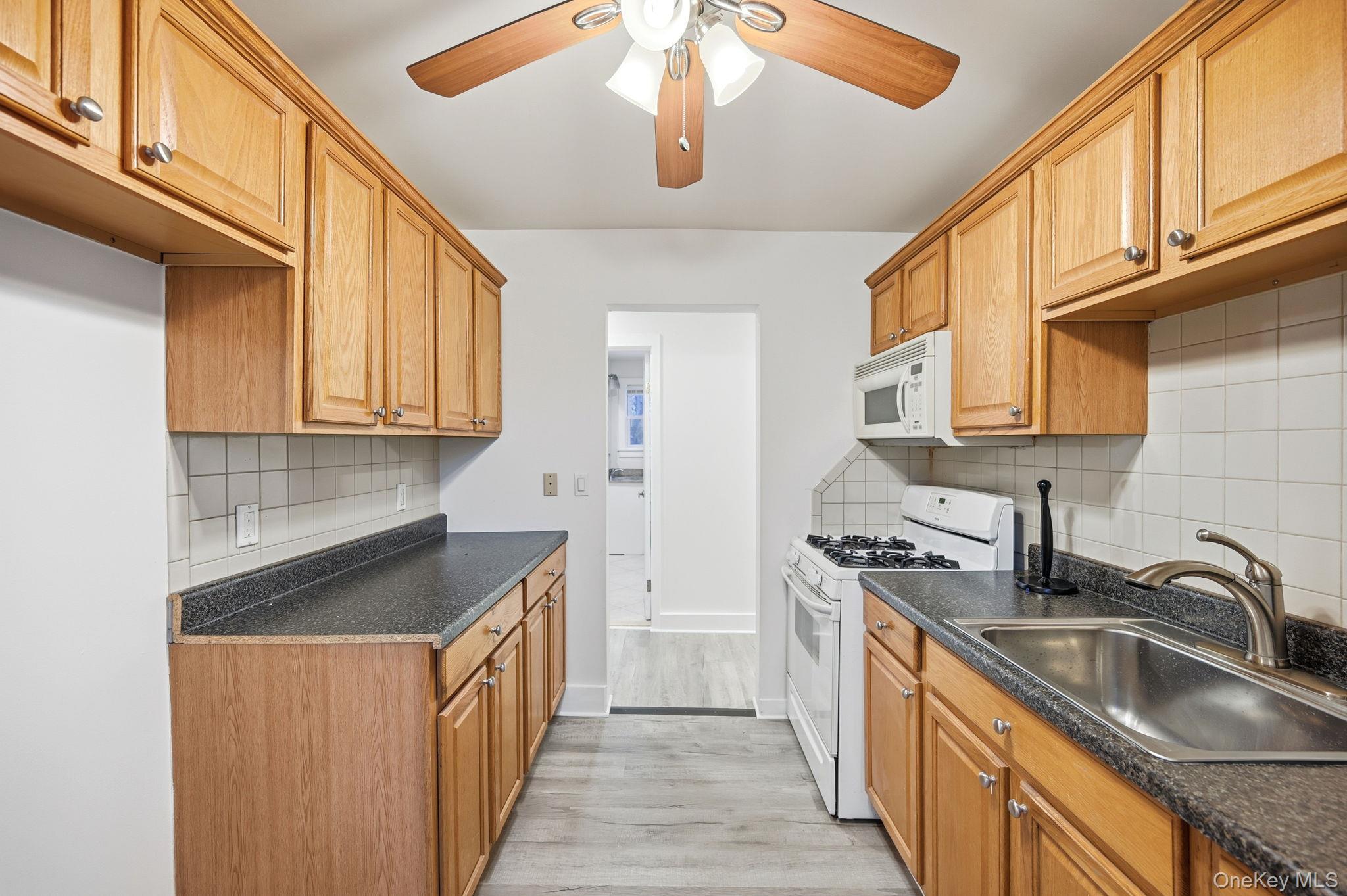 359 Orangeburg Road, Unit 2 Pearl River, NY 10965 - Photo 12 of 39 a kitchen with stainless steel appliances granite countertop a sink and cabinets