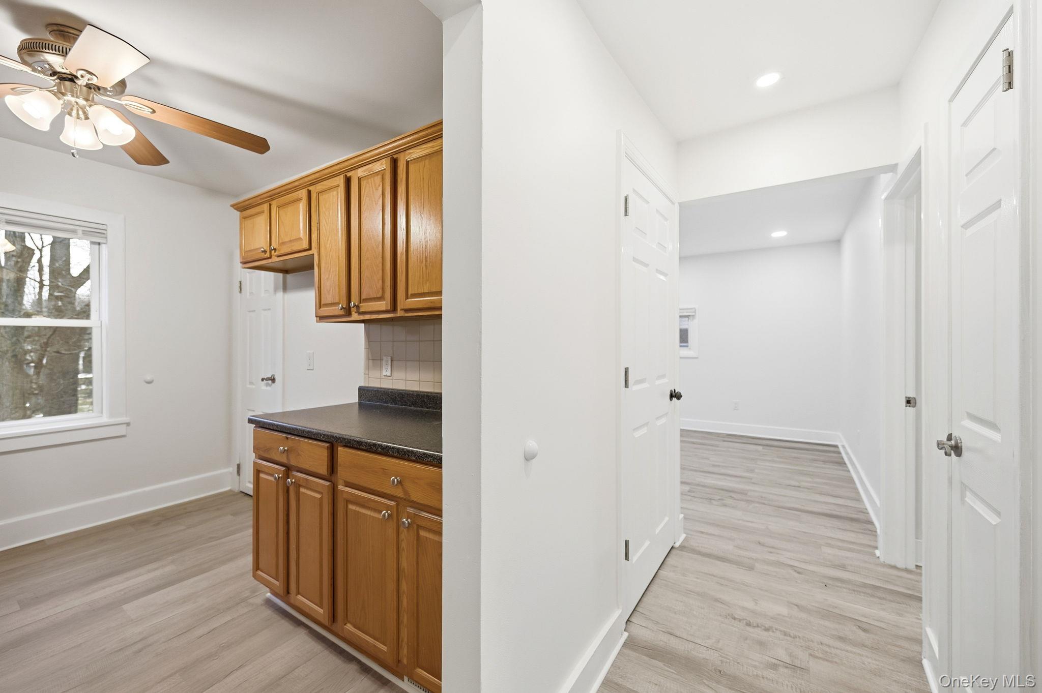 359 Orangeburg Road, Unit 2 Pearl River, NY 10965 - Photo 15 of 39 a hallway view with wooden floor and staircase