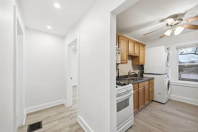 a kitchen with stainless steel appliances a stove a sink and a refrigerator