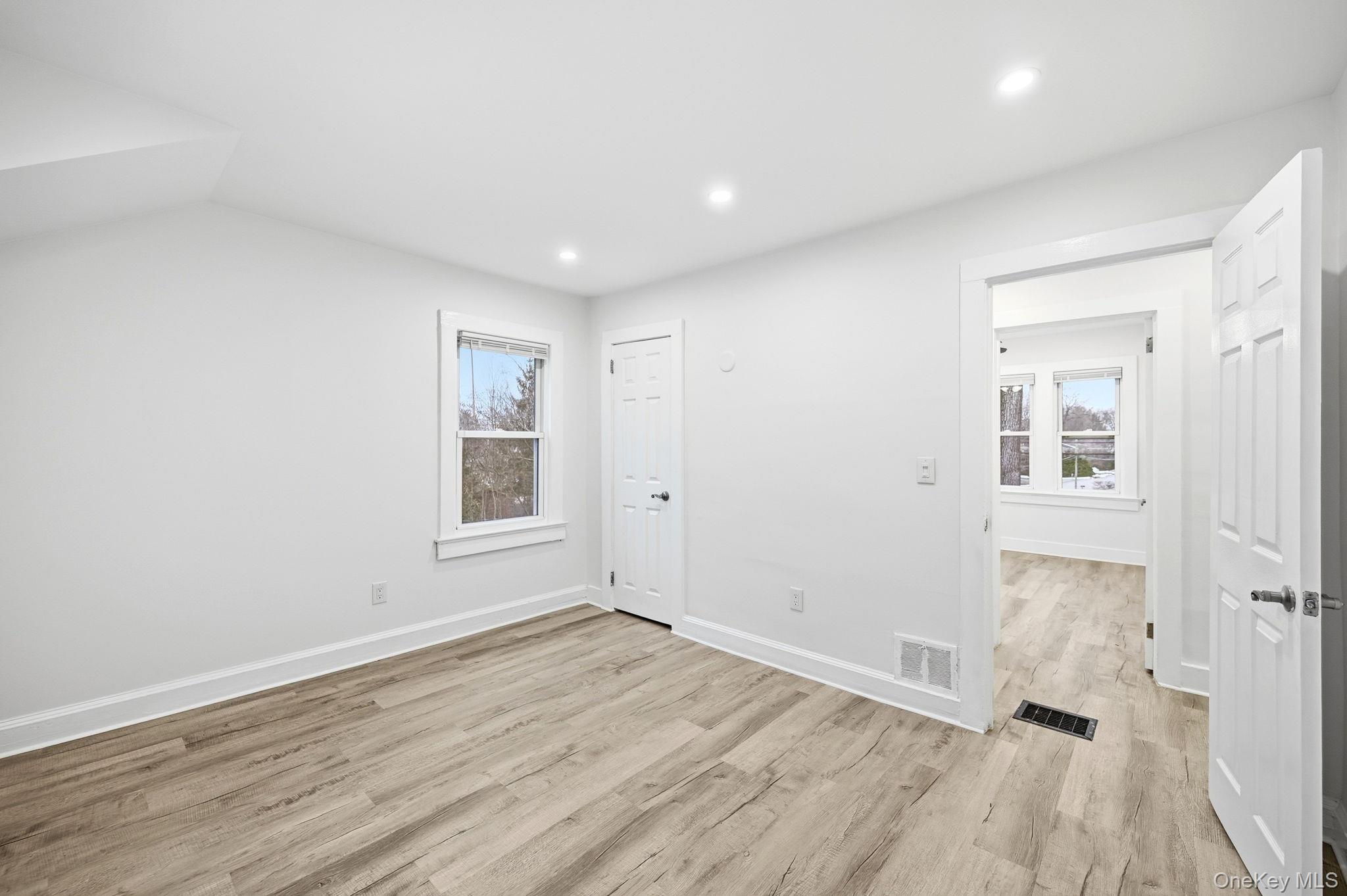 359 Orangeburg Road, Unit 2 Pearl River, NY 10965 - Photo 20 of 39 an empty room with wooden floor and windows