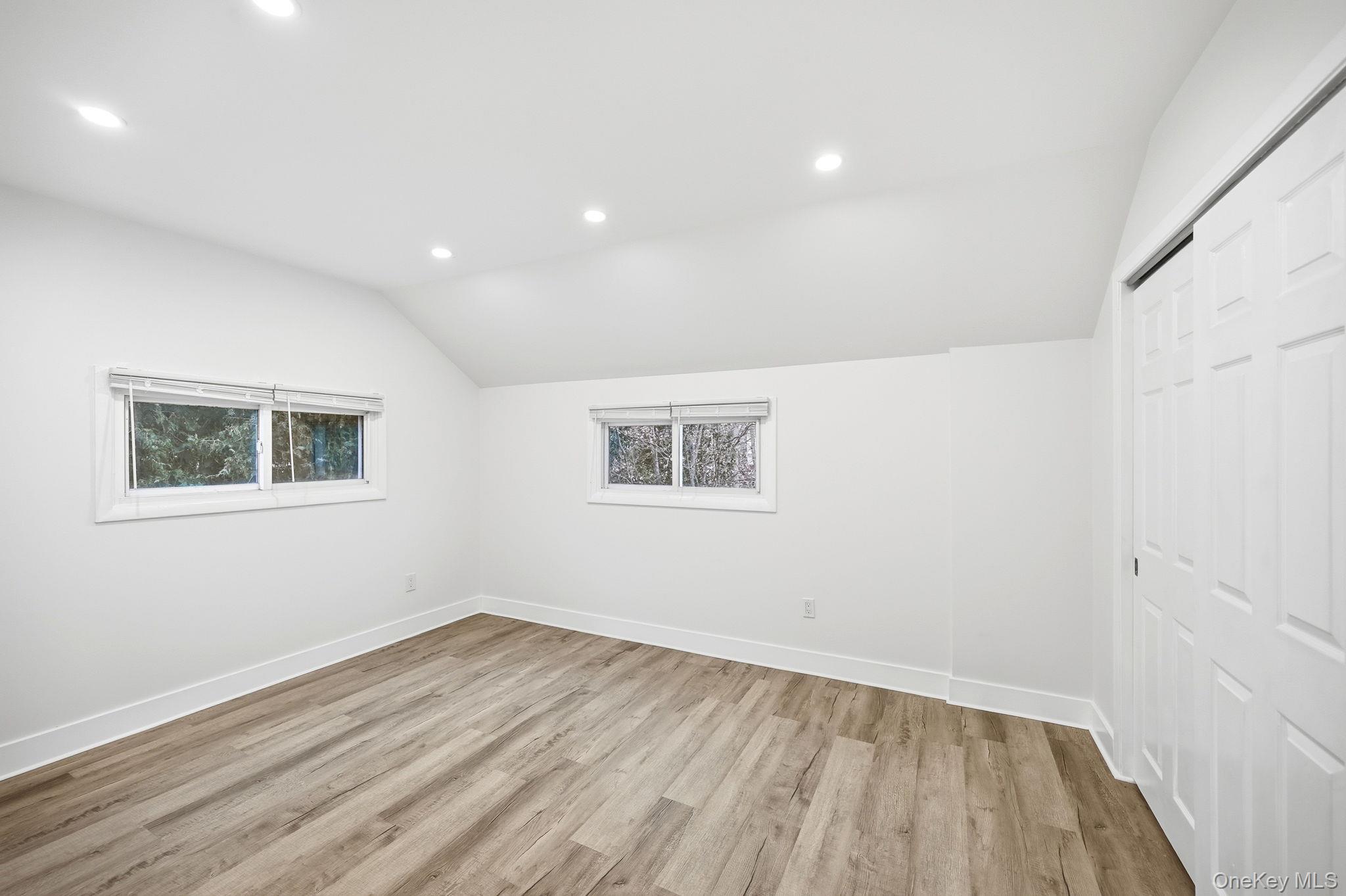 359 Orangeburg Road, Unit 2 Pearl River, NY 10965 - Photo 28 of 39 a view of an empty room with wooden floor and a window