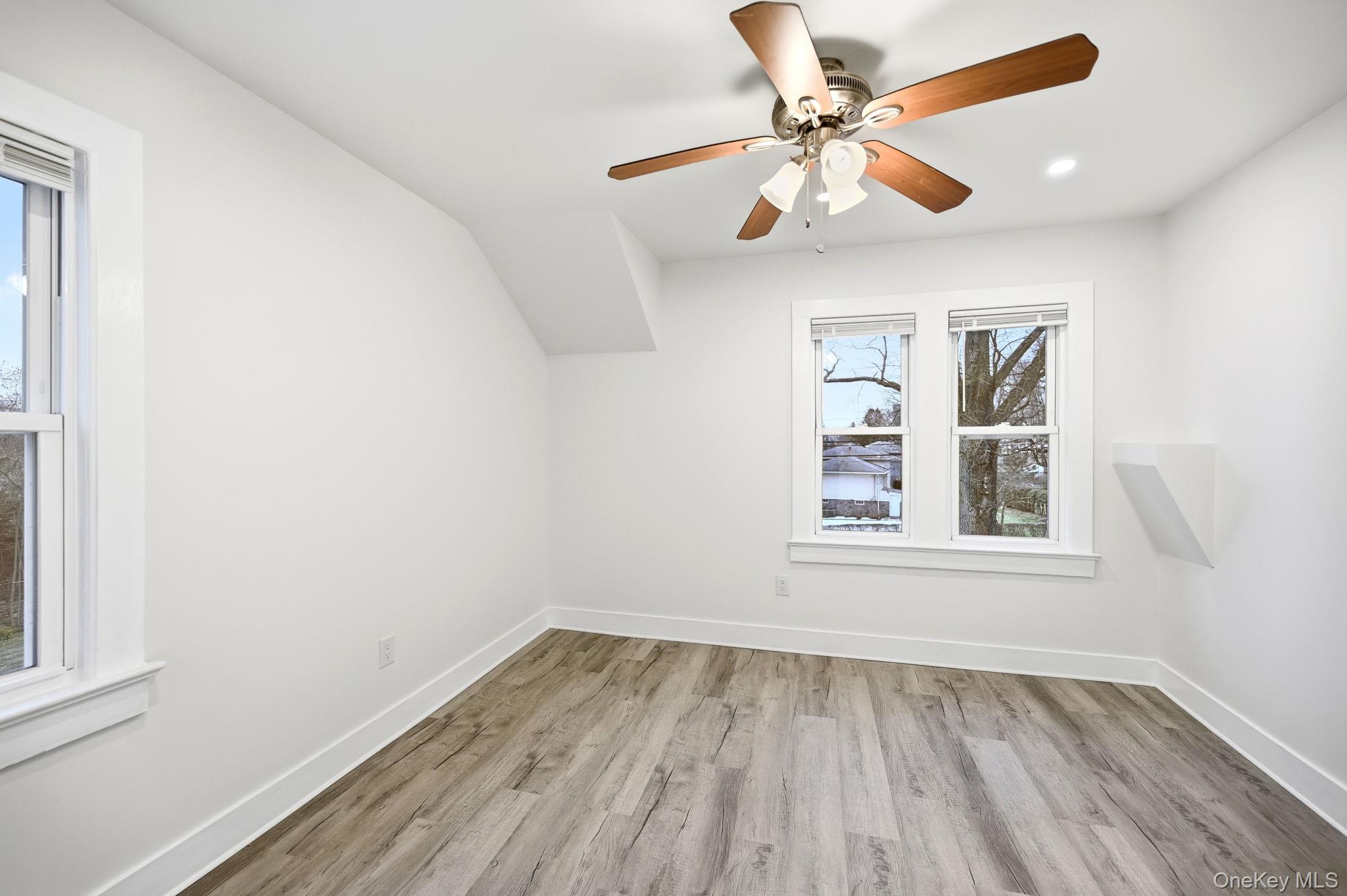 359 Orangeburg Road, Unit 2 Pearl River, NY 10965 - Photo 34 of 39 an empty room with a window and a ceiling fan