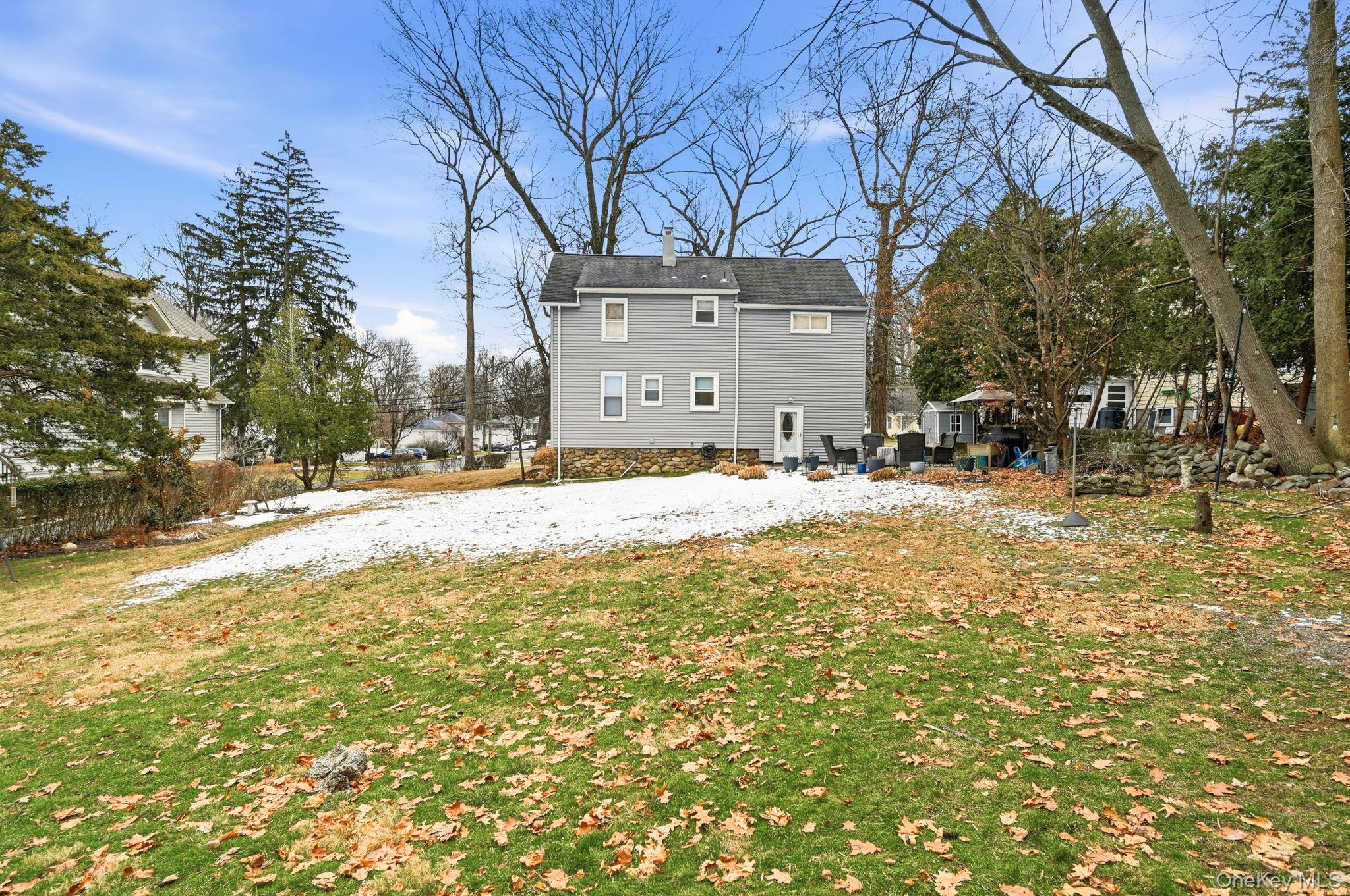 359 Orangeburg Road, Unit 2 Pearl River, NY 10965 - Photo 37 of 39 a house with trees in front of it