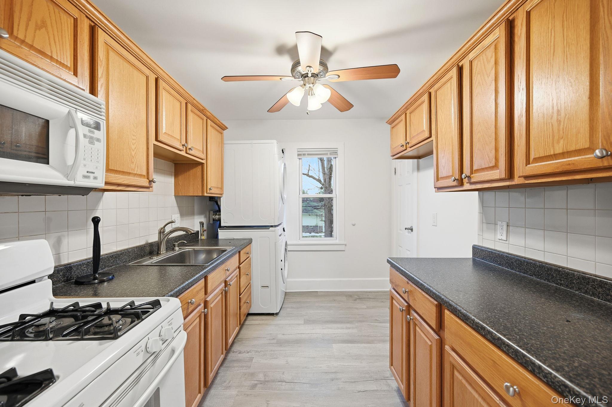359 Orangeburg Road, Unit 2 Pearl River, NY 10965 - Photo 9 of 39 a kitchen with stainless steel appliances granite countertop a sink stove and cabinets