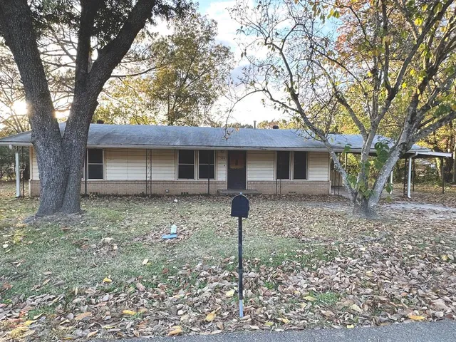 a view of kitchen with refrigerator stove microwave and stove