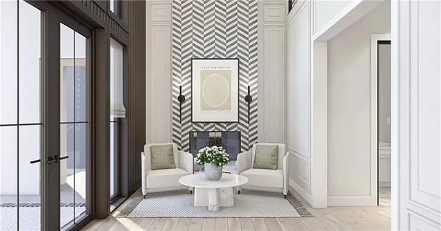 a living room with furniture a fireplace and a large window