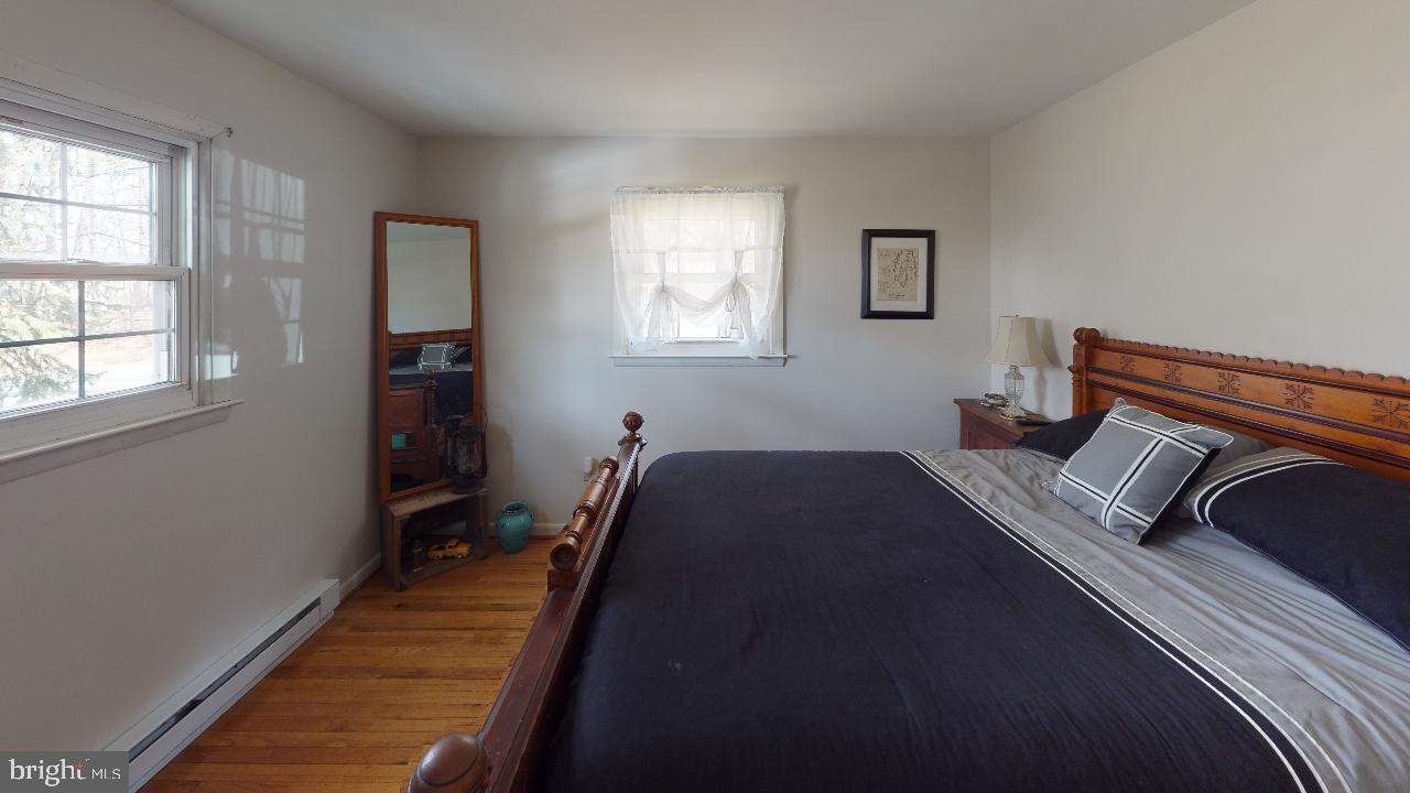 793 Mountain View Road Reading, PA 19607 - Photo 14 of 21 a bedroom with a bed and window