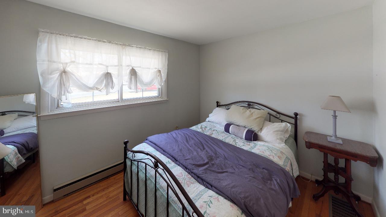 793 Mountain View Road Reading, PA 19607 - Photo 16 of 21 a bedroom with a bed and wooden floor