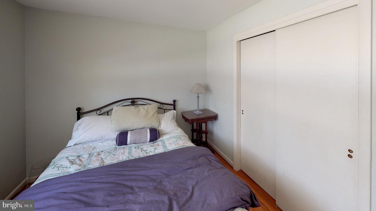 793 Mountain View Road Reading, PA 19607 - Photo 17 of 21 a bedroom with a bed and a small yard