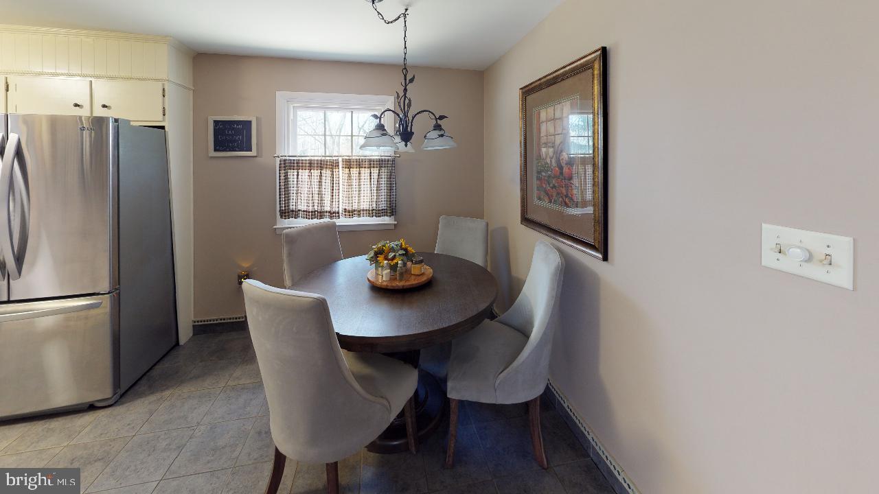 793 Mountain View Road Reading, PA 19607 - Photo 6 of 21 a view of a dining room with furniture window and wooden floor
