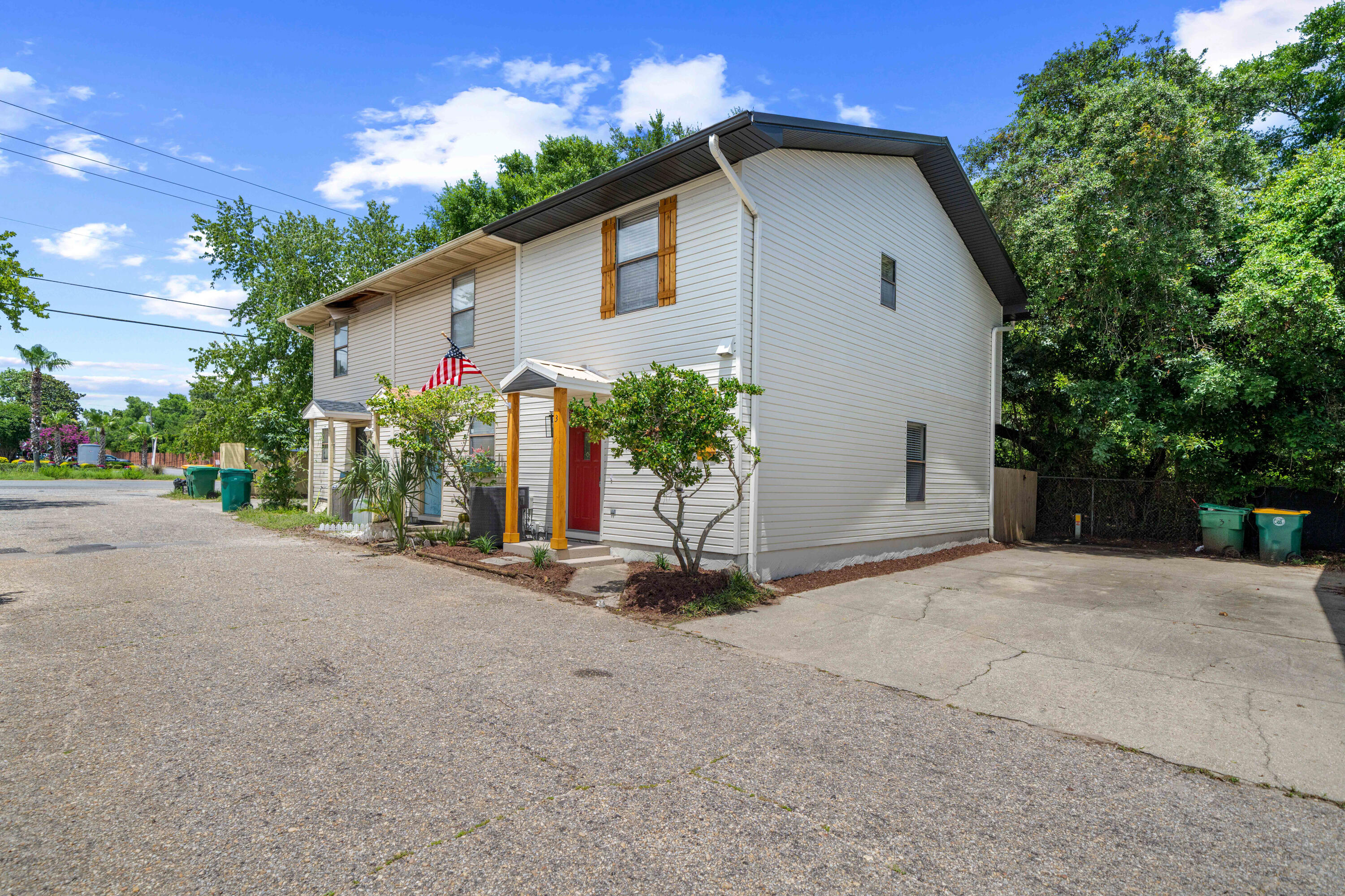 1681 Highway 98, Unit 3 Mary Esther, FL 32569 - Photo 21 of 21 a view of a house with a yard and garage