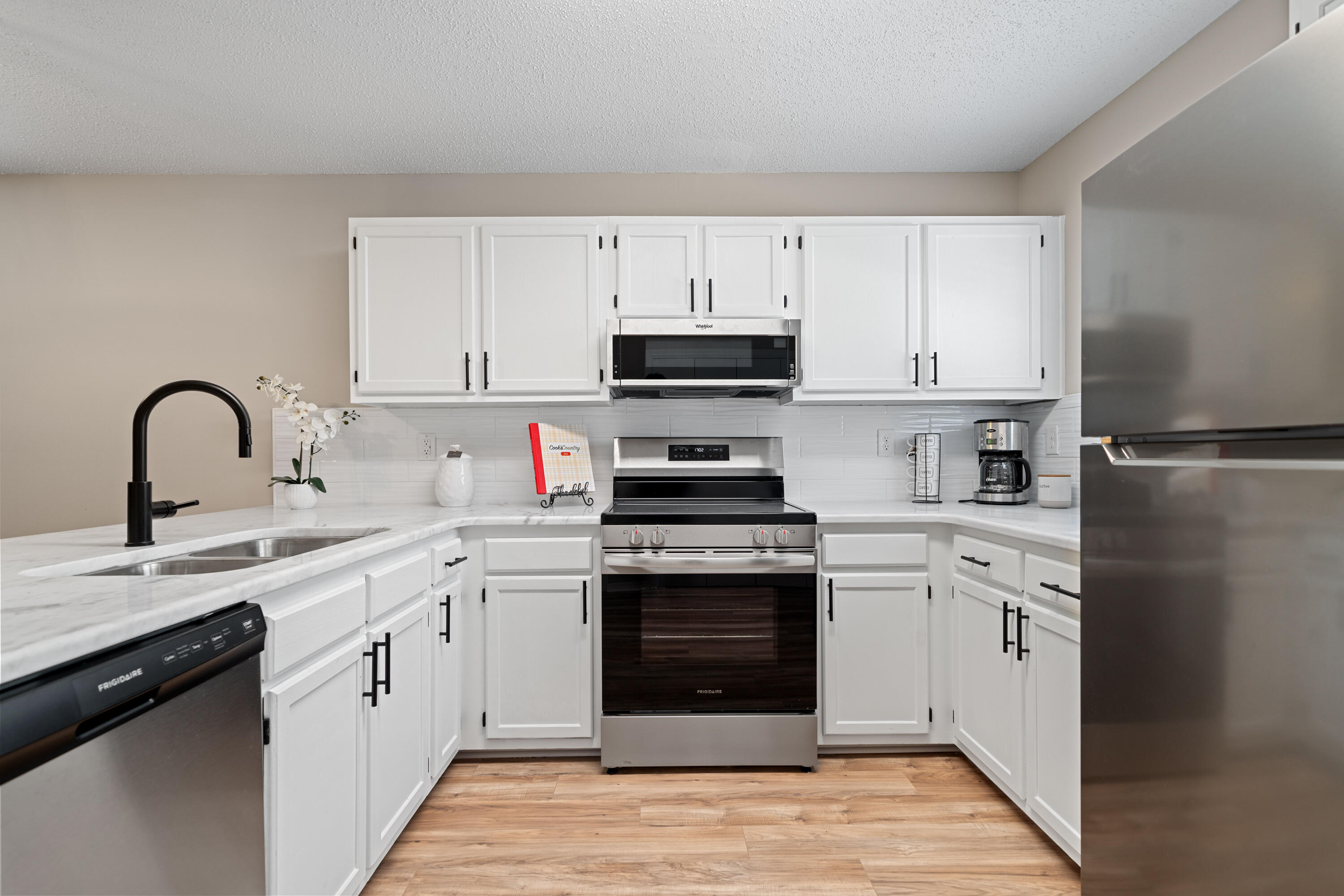 1681 Highway 98, Unit 3 Mary Esther, FL 32569 - Photo 3 of 21 a kitchen with a sink stove and refrigerator