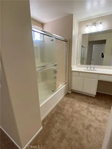 a bathroom with a bathtub and a sink