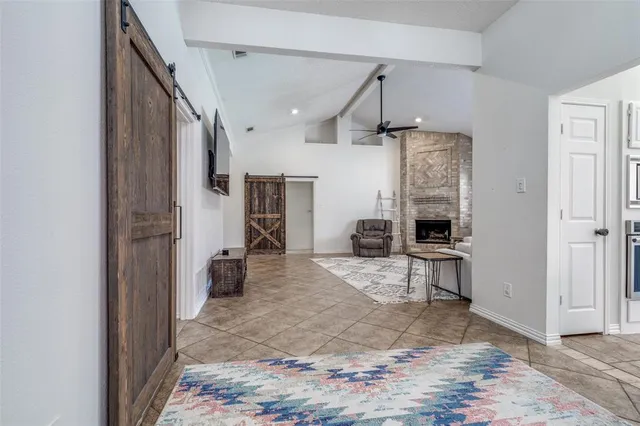 a view of a kitchen with a refrigerator and a sink