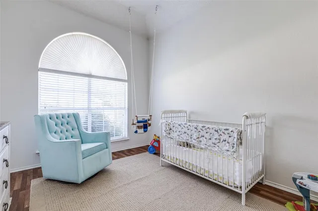 a bedroom with furniture and a window