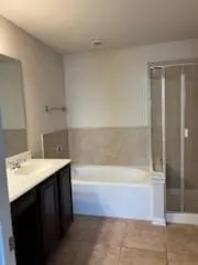 a bathroom with a bathtub and a sink