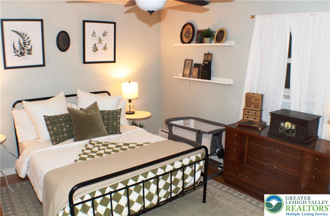 3604 Belfry Road Northampton, PA 18067 - Photo 23 of 44 a bedroom with a bed and wooden floor