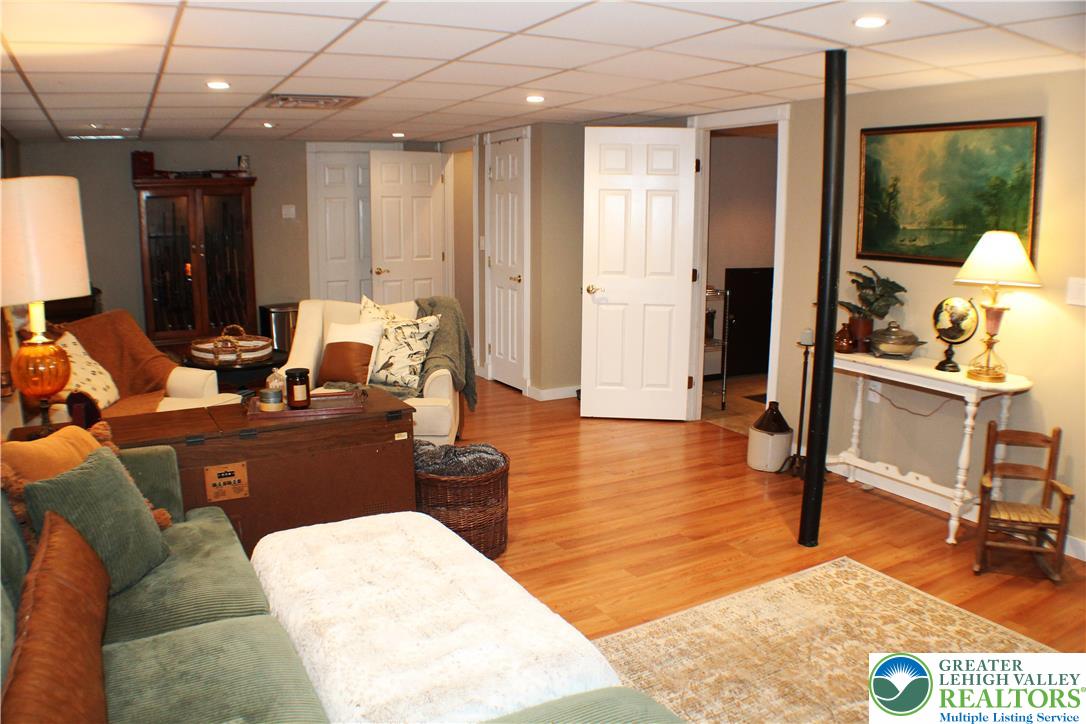3604 Belfry Road Northampton, PA 18067 - Photo 35 of 44 a living room with furniture a large mirror and a view of dining room