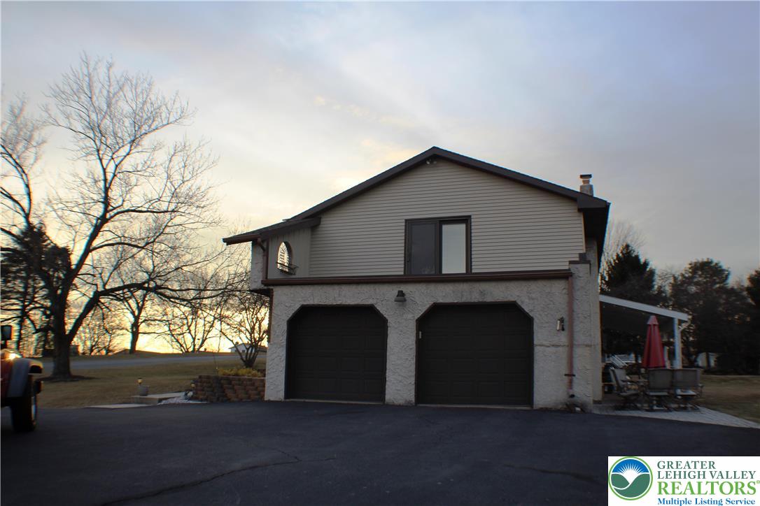 3604 Belfry Road Northampton, PA 18067 - Photo 4 of 44 a front view of a house with yard and parking