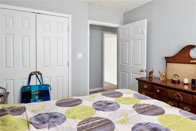 a bedroom with bed and a window