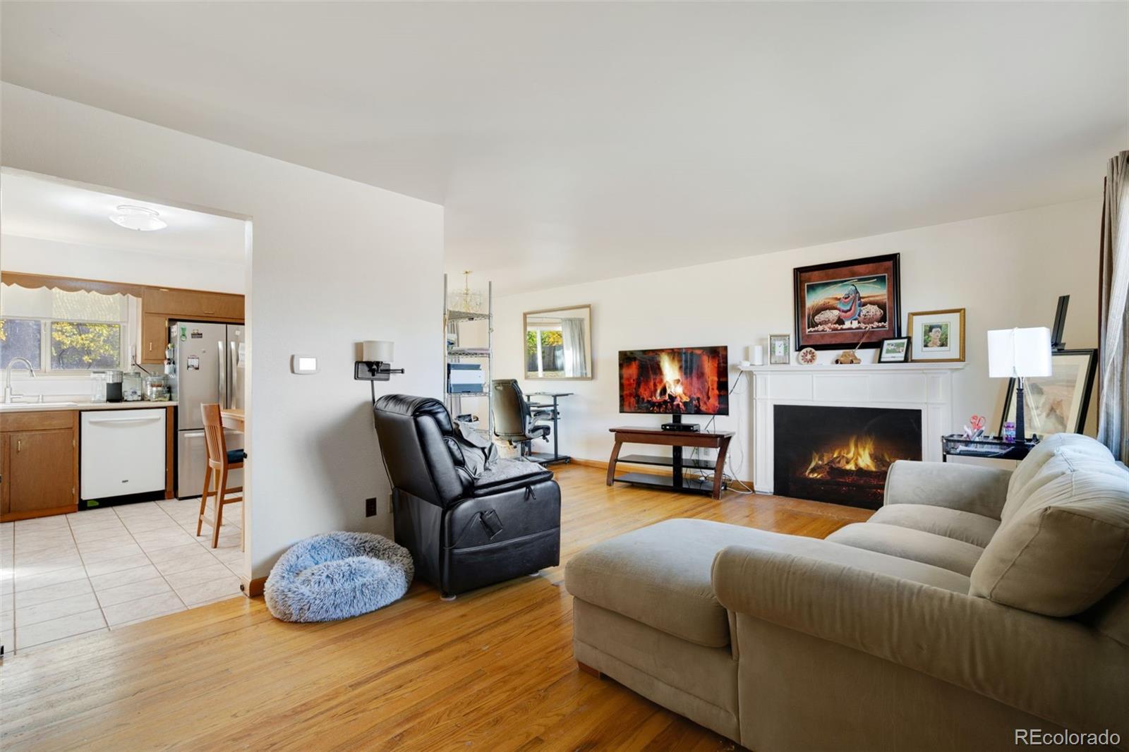 11760 West 32nd Avenue Wheat Ridge, CO 80215 - Photo 12 of 28 a living room with furniture and a fireplace