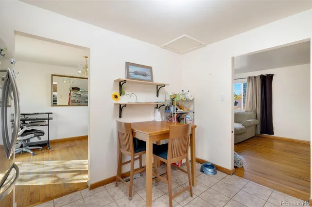 a view of a livingroom with furniture and a flat screen tv