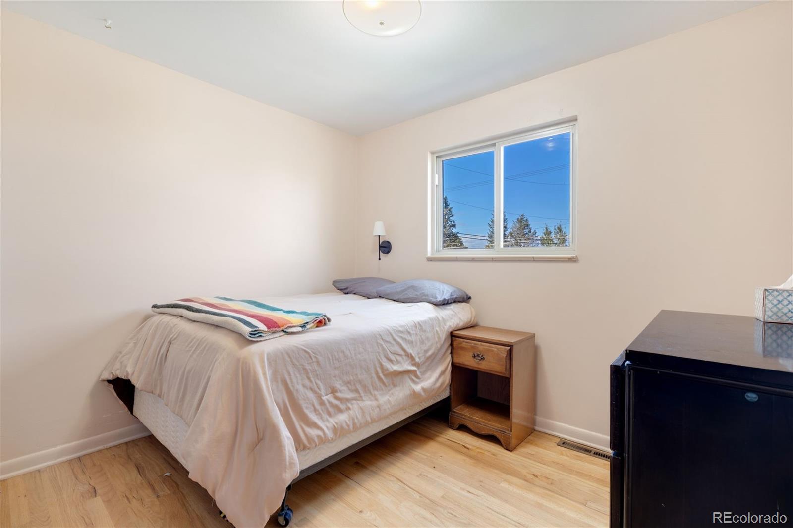 11760 West 32nd Avenue Wheat Ridge, CO 80215 - Photo 19 of 28 a bedroom with a bed and a desk