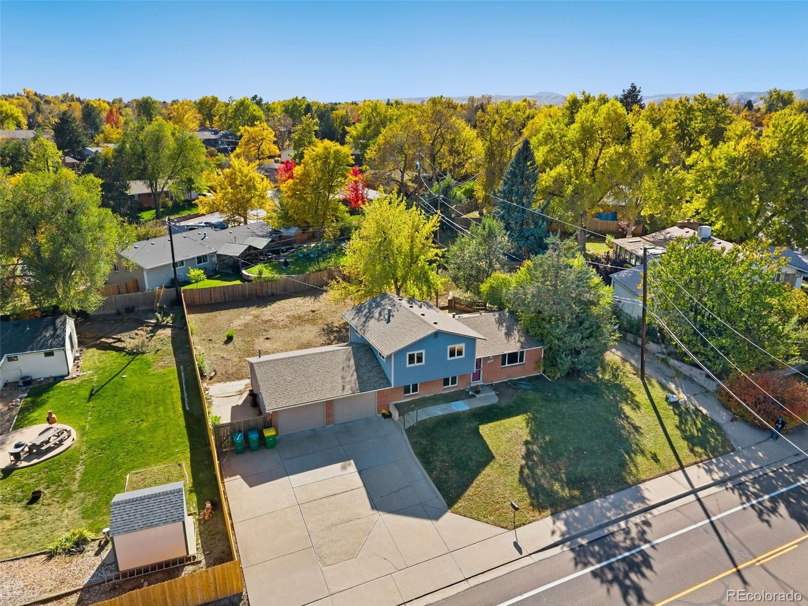 11760 West 32nd Avenue Wheat Ridge, CO 80215 - Photo 24 of 28 an aerial view of residential houses with outdoor space
