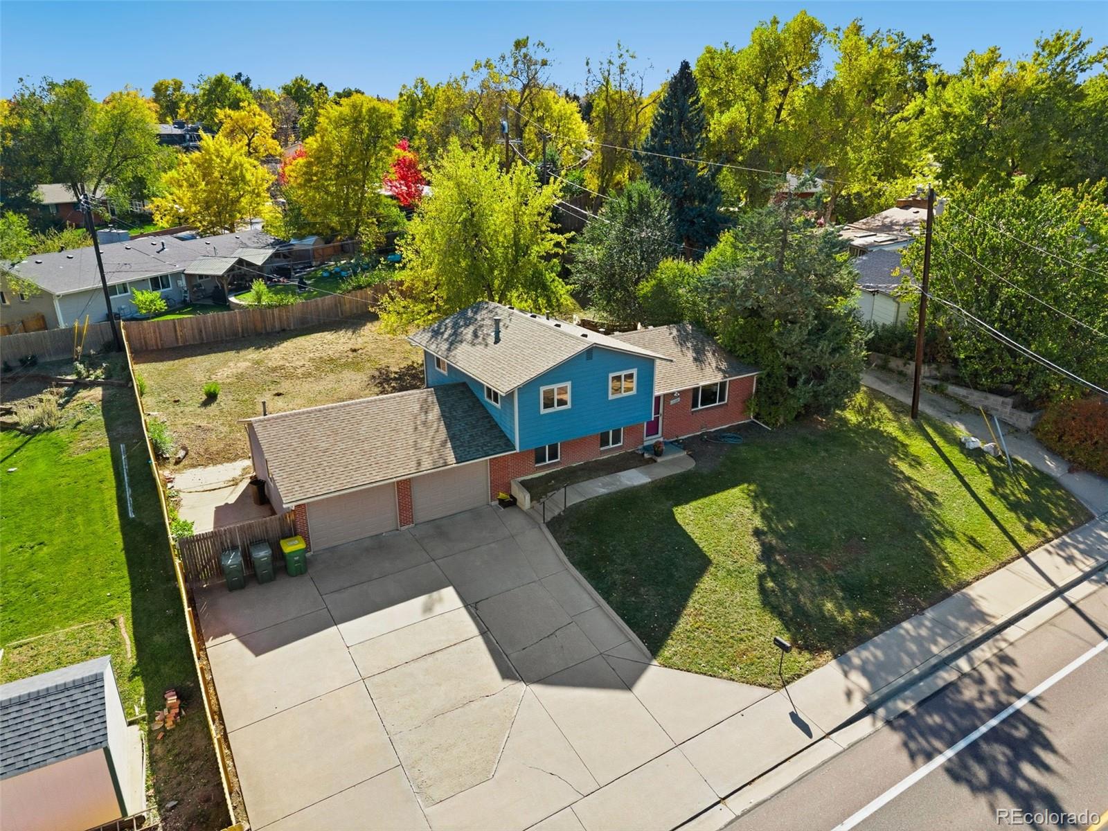 11760 West 32nd Avenue Wheat Ridge, CO 80215 - Photo 26 of 28 a view of yard with swimming pool and outdoor seating