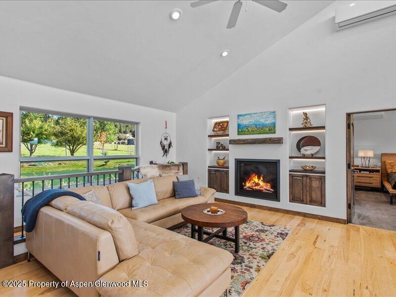 4100 County Road 103 Carbondale, CO 81623 - Photo 14 of 43 a living room with furniture fireplace and a table