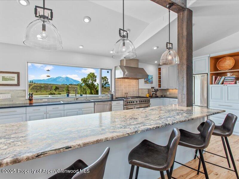 4100 County Road 103 Carbondale, CO 81623 - Photo 20 of 43 a large kitchen with granite countertop a counter space and a sink