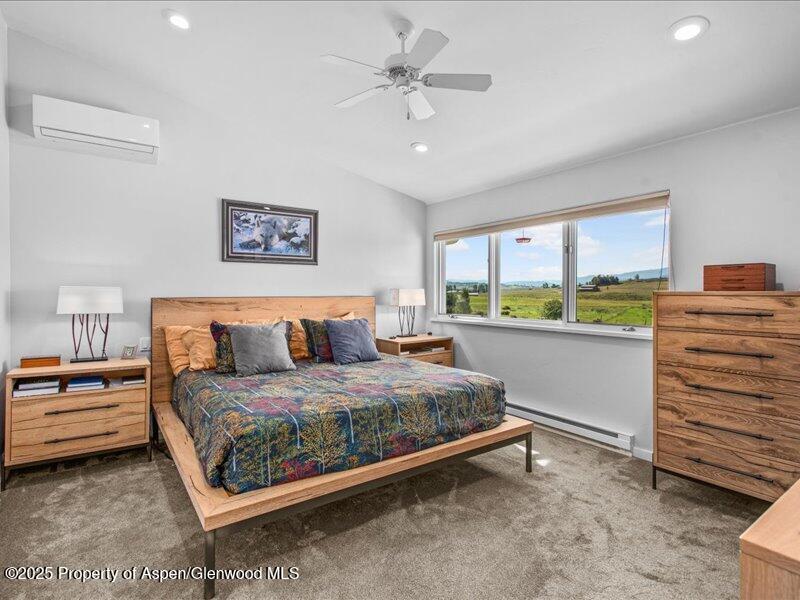 4100 County Road 103 Carbondale, CO 81623 - Photo 22 of 43 a bedroom with a bed and a dresser