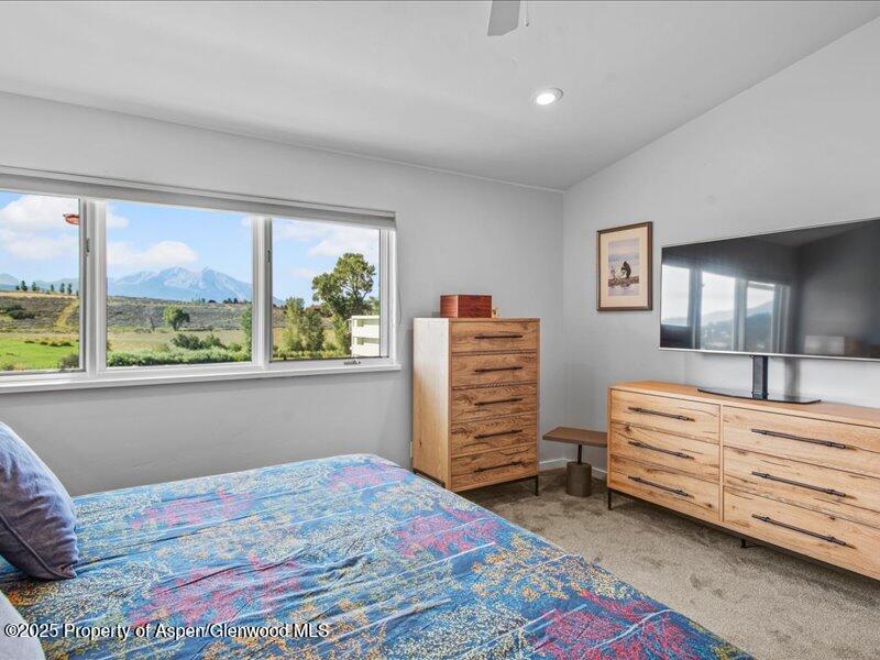 4100 County Road 103 Carbondale, CO 81623 - Photo 25 of 43 a bedroom with a bed and a window