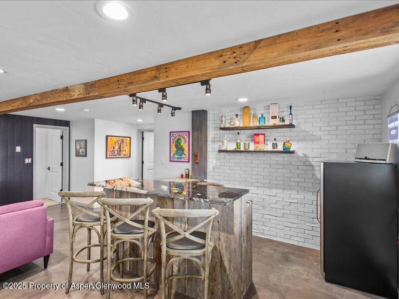4100 County Road 103 Carbondale, CO 81623 - Photo 30 of 43 a dining room with furniture and wooden floor