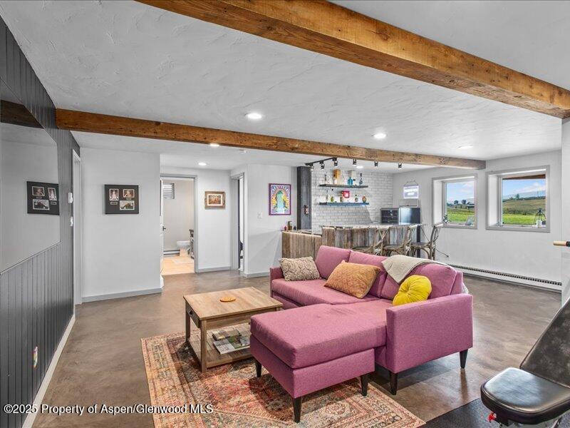 4100 County Road 103 Carbondale, CO 81623 - Photo 31 of 43 a living room with furniture and wooden floor