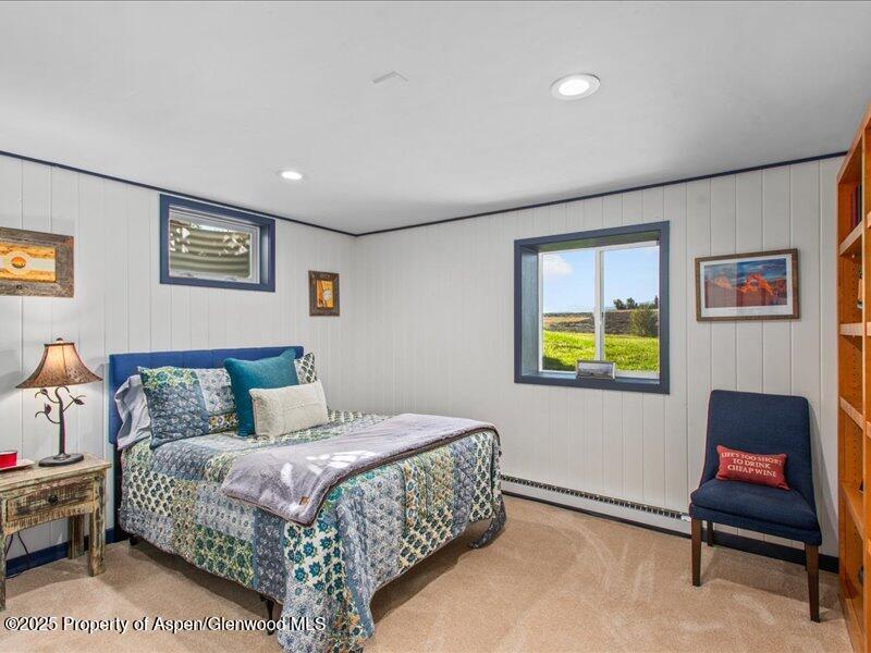 4100 County Road 103 Carbondale, CO 81623 - Photo 32 of 43 a bedroom with a bed and painting on the wall