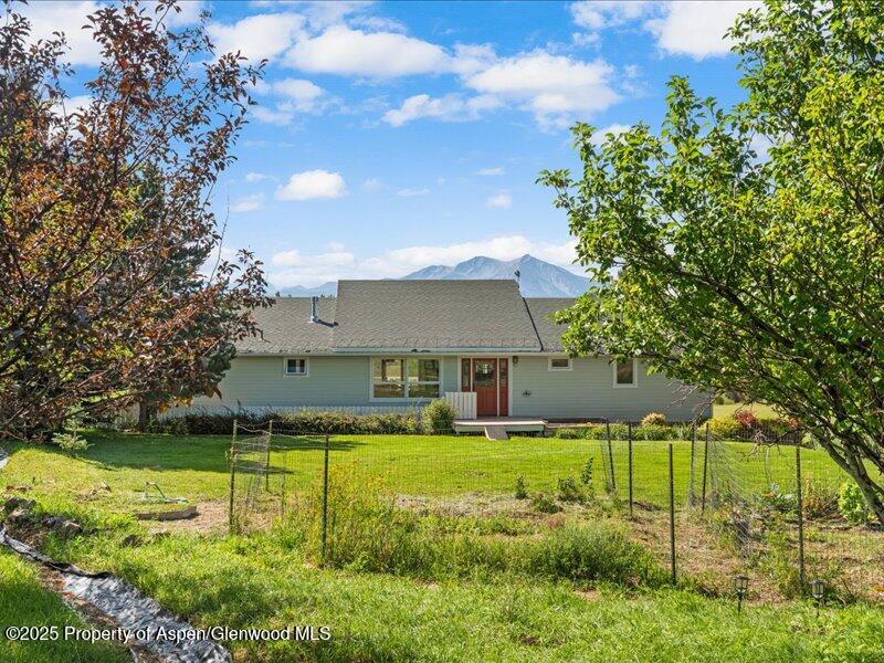 4100 County Road 103 Carbondale, CO 81623 - Photo 39 of 43 a view of a house with a big yard and potted plants