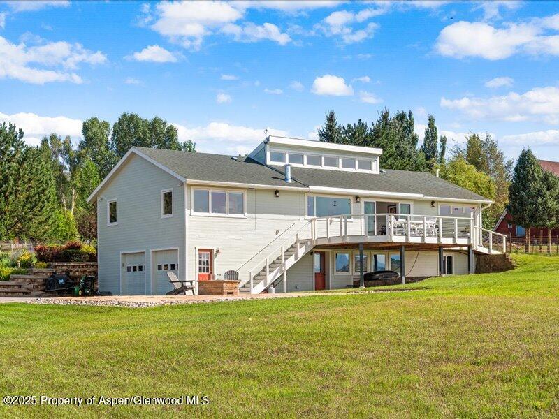 4100 County Road 103 Carbondale, CO 81623 - Photo 42 of 43 a view of a house with a big yard and large trees