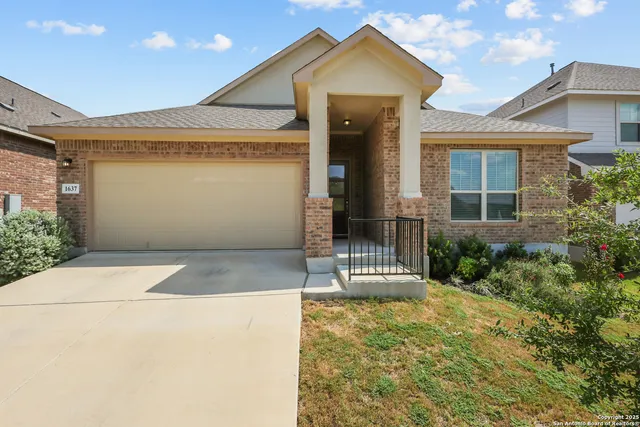 a front view of a house with a garage